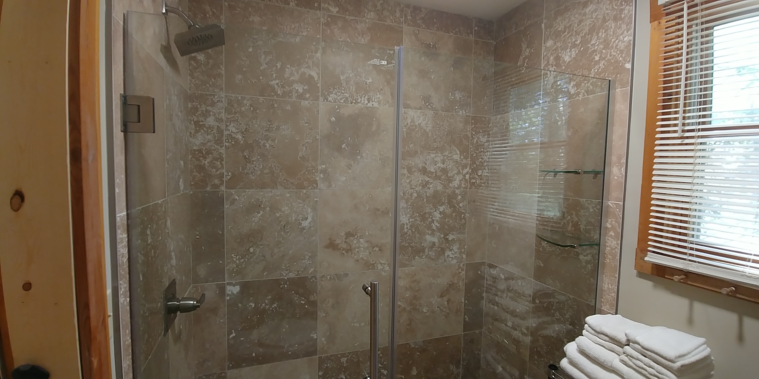 Photo 619_12203.jpg - Features walk in tile shower with glass doors, toilet and sink/vanity