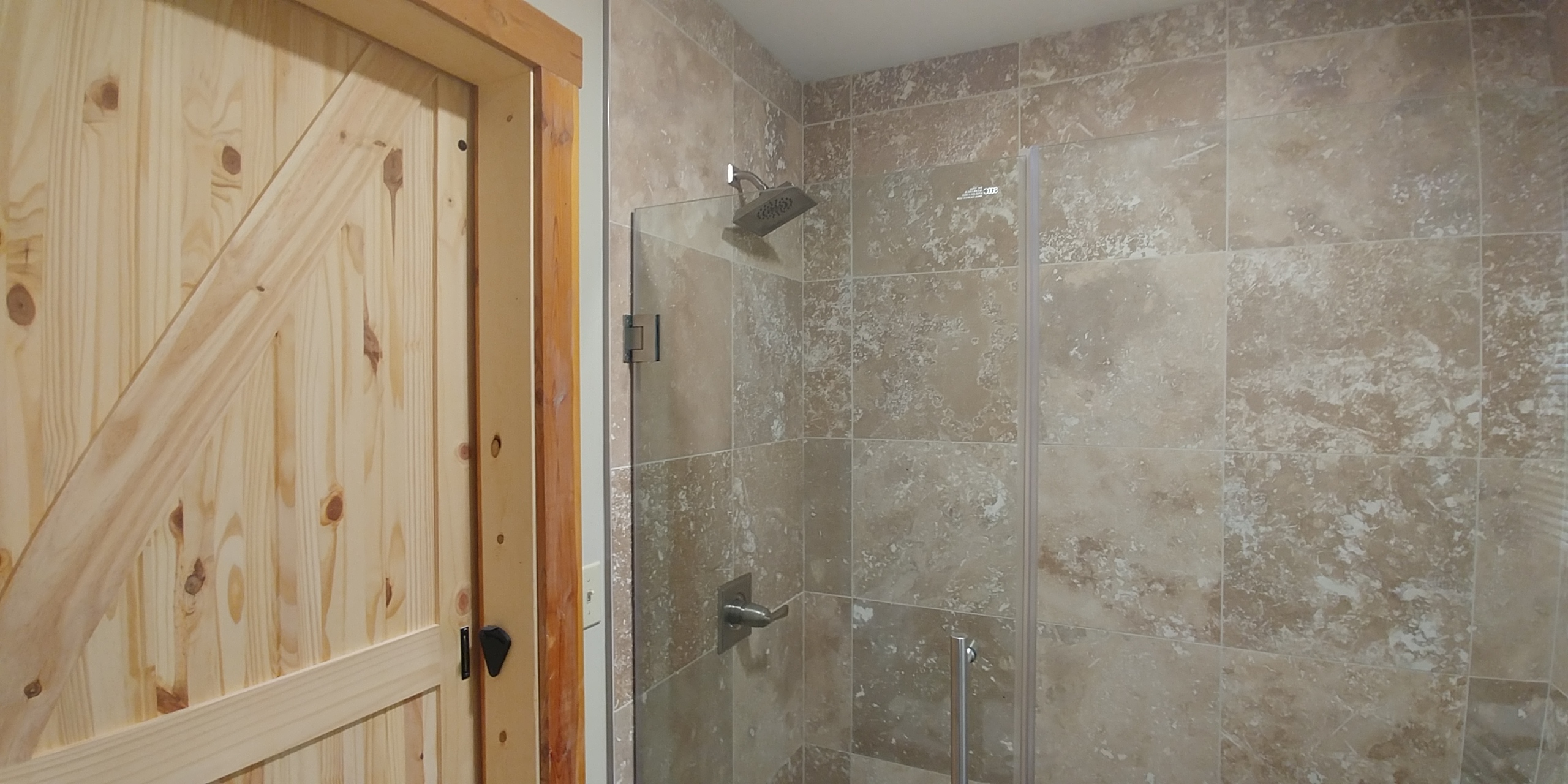 Photo 619_12205.jpg - Features walk in tile shower with glass doors, toilet and sink/vanity