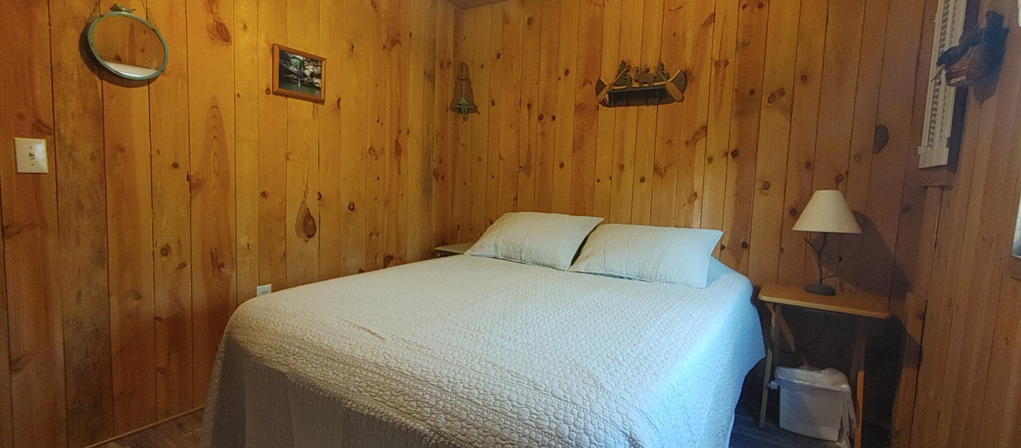 Photo 625_12512.jpg - Knotty pine walls and ceiling give this space a traditional cabin feel. 